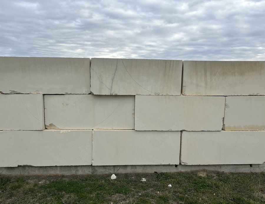 Large-format cut-stone block wall