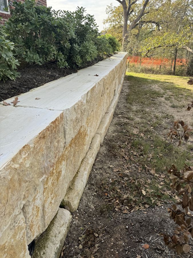 Cut stone garden retaining wall