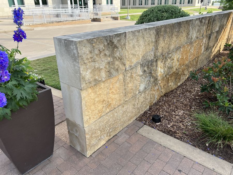 Cut limestone wall at commercial building
