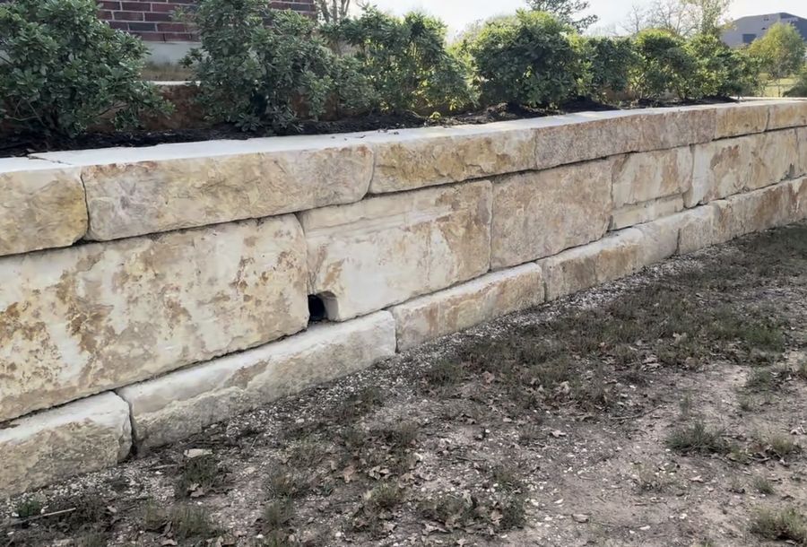 Mortared limestone wall with drainage
